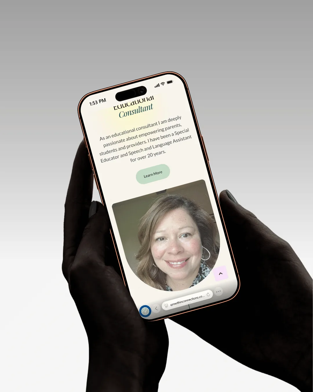 The consultant’s profile held in hand — Giselle’s portrait and introduction on a phone