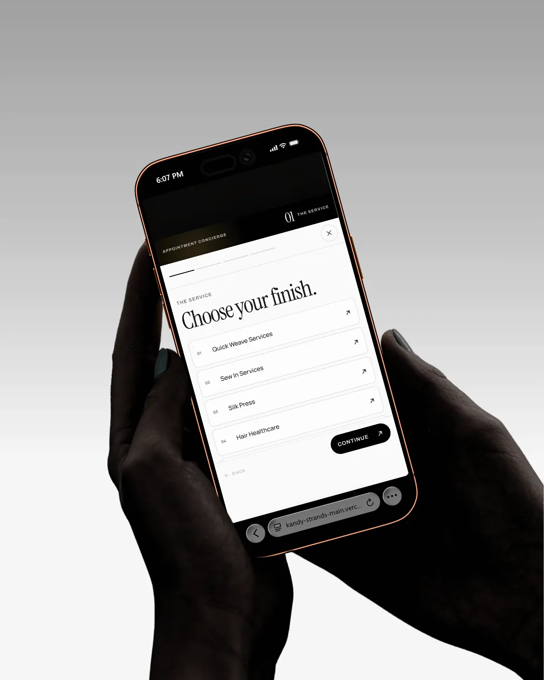 The appointment planner held in hand — “Choose your finish.” over a numbered list of service categories